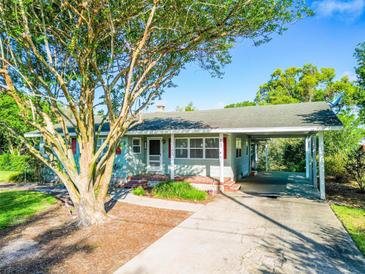 Charming single-story home with a covered carport and well-maintained front yard at 1371 Sheridan Sw St, Winter Haven, FL 33880