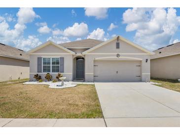 Charming single-story home with a well-maintained lawn and inviting curb appeal at 180 Grove Branch Rd, Winter Haven, FL 33880