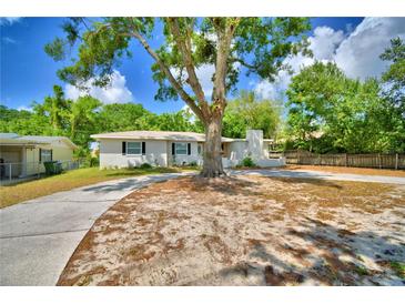 Charming single-story home with a large shade tree and inviting curb appeal at 1919 19Th Nw St, Winter Haven, FL 33881