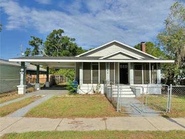 Charming single-story home with a covered carport and fenced yard at 602 Nw 1St Ave, Mulberry, FL 33860