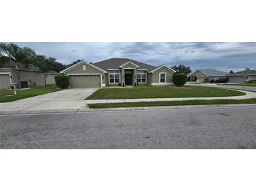 Charming single-story home with well-maintained lawn and neutral exterior paint at 1400 Eagle Crest Blvd, Winter Haven, FL 33881