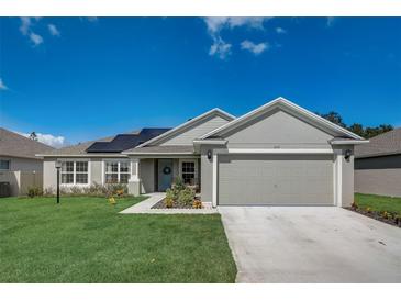 Charming single-story home with a well-manicured lawn and inviting curb appeal at 620 Jaxson Blvd, Winter Haven, FL 33880