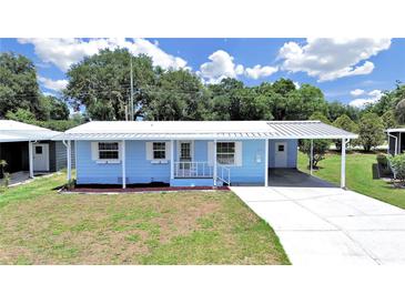 Charming single-story home with a carport and well-maintained front yard at 4859 Foxwood Blvd, Lakeland, FL 33810