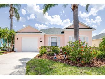 Charming single Gathering home in a lush landscaped yard with a garage at 263 Reserve Dr, Davenport, FL 33896