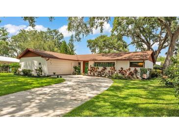 Charming single-story home with lush front lawn and inviting curb appeal at 527 Duchess Dr, Lakeland, FL 33803