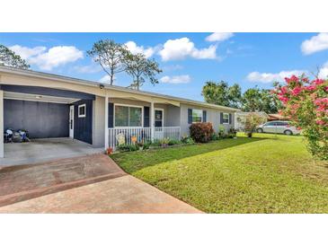Charming single story home with brick accents, carport, well-maintained lawn, and inviting curb appeal at 1019 Milner E Dr, Lakeland, FL 33810