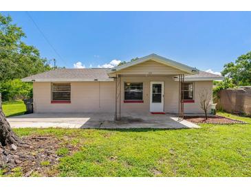 Charming single story home with a well-kept lawn and a cozy front porch, perfect for relaxing at 407 Snively Ave, Winter Haven, FL 33880