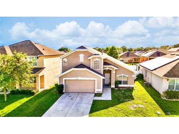 Charming two-story home featuring well-maintained landscaping and an attached two-car garage at 2169 Rose Blvd, Winter Haven, FL 33881
