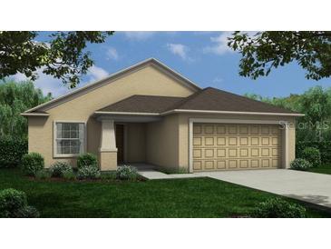 Tan one-story house with brown roof, attached garage, and landscaped yard at 2181 Emma Ln, Lake Wales, FL 33859