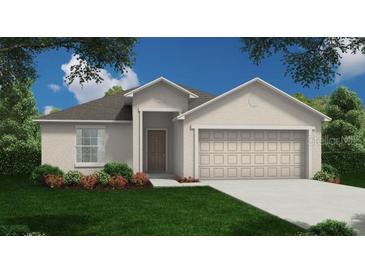 One-story house with attached garage and landscaped front yard at 223 Bryce Ln, Frostproof, FL 33843