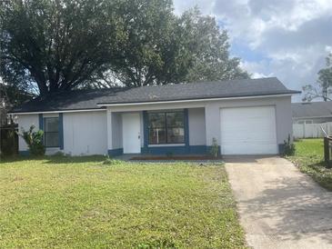 Newly renovated single story home with a one car garage and well manicured lawn at 260 Cranbrook Dr, Kissimmee, FL 34758