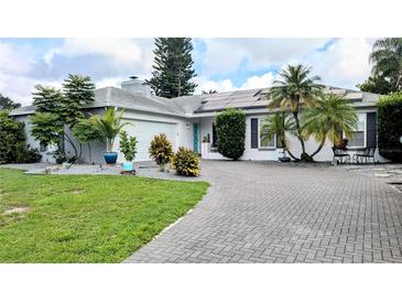 Charming single story home with landscaped yard and solar panels at 2809 Bower Rd, Winter Park, FL 32792