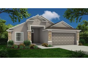 One-story home with stone accents and a two-car garage at 3556 Elliot Pl, Bartow, FL 33830