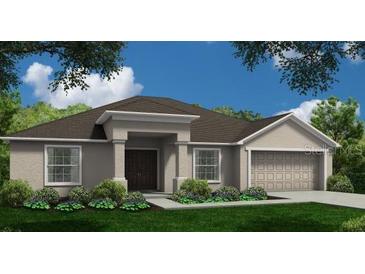 One-story home with a two-car garage and landscaped front yard at 758 Old Polk City Rd, Lakeland, FL 33809