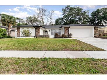 Charming single Gathering home with a well-manicured front yard and stone accents at 1928 South Blvd, Maitland, FL 32751