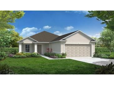 Charming single-story home featuring a two-car garage and a beautifully landscaped front yard at 2173 Lincoln Ln, Bartow, FL 33830