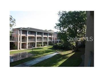 Multi-story building with well-maintained landscaping and exterior walkways at 125 Water Front Way # 200, Altamonte Springs, FL 32701