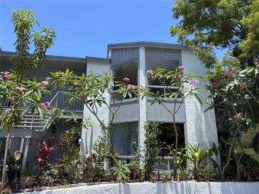 Attractive condo building surrounded by lush tropical landscaping, a serene and inviting complex at 4318 Aqua Vista Dr # K, Orlando, FL 32839