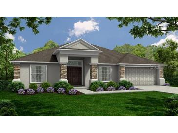 Charming single-story home featuring stone accents, a neatly manicured lawn, and a two car garage at 566 Gandy Cemetary Rd, Bartow, FL 33830