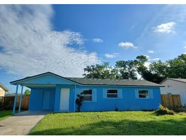 Charming single-story home features a neatly maintained lawn and welcoming curb appeal at 5390 Botany Ct, Orlando, FL 32811