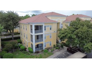 Beautiful condo building featuring a well-maintained exterior and a tile roof at 1100 Lake Shadow Cir # 2101, Maitland, FL 32751