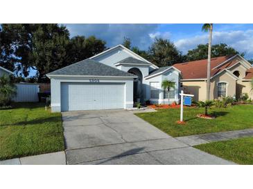 Charming single-Gathering home with well-maintained lawn and two car garage at 5906 Rywood Dr, Orlando, FL 32810