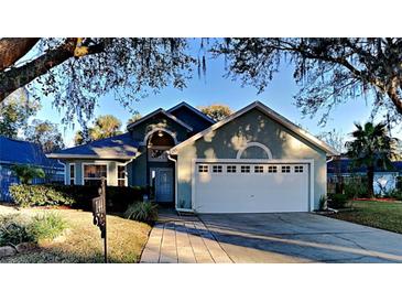 Charming single-story home with mature trees and a well-maintained lawn at 144 Rose Hill Trl, Sanford, FL 32773