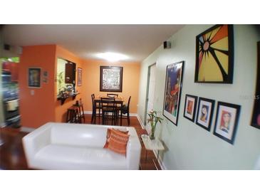 Bright dining area with table and chairs, adjacent to kitchen at 2041 Dixie Belle Dr # 2041P, Orlando, FL 32812