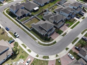 An aerial shot displaying the house and neighborhood at 1222 Castlevecchio Loop, Orlando, FL 32825