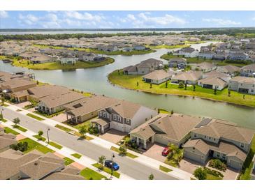 Beautiful aerial view of a neighborhood featuring houses and lakes at 2949 Nottel Dr, St Cloud, FL 34772