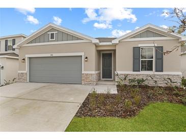 Beautiful single-Gathering home with a well-manicured lawn and a two-car garage at 1742 Carnelian St, Deland, FL 32720