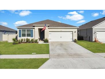 One-story home with two-car garage and landscaped lawn at 5109 Barombi Bnd, Saint Cloud, FL 34772