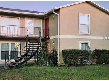 Two-story building with a spiral staircase and landscaping at 1855 Caralee Blvd # 2, Orlando, FL 32822