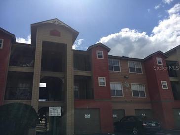 Attractive three-story building with garages and parking at 2218 Grand Cayman Ct # 1335, Kissimmee, FL 34741