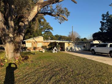 Ranch style home with mature landscaping and spacious yard at 4235 Edgewater Dr, Orlando, FL 32804