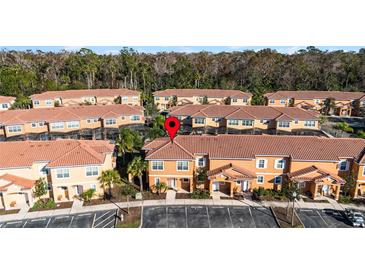 Aerial view of townhouses with a focus on one unit at 2621 Bugatti Ct, Kissimmee, FL 34746