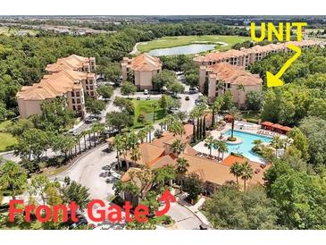 Aerial view of condo community, pool, and golf course at 1375 Tuscana Ln # 1106, Davenport, FL 33896