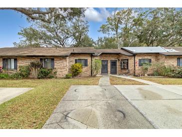 Brick building exterior with a walkway and driveway at 1821 Foxhall Cir # 1005, Kissimmee, FL 34741