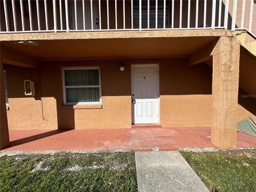 Exterior view of condo building, showing the entrance to unit 2 at 710 Michigan Ct # 2, St Cloud, FL 34769