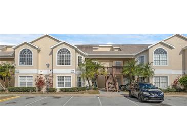Two-story condo building with parking and landscaping at 2317 Prime Cir # B, Kissimmee, FL 34746