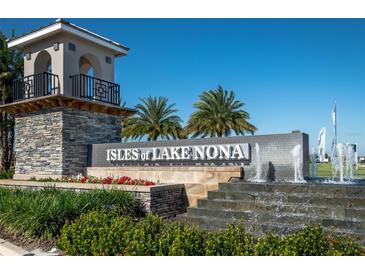 Community entrance of Isles of Lake Nona with water feature at 10425 Folly Beach Rd, Orlando, FL 32827