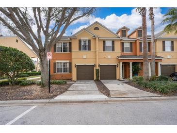 Charming townhome with a private garage and well-maintained landscaping in a vibrant community at 7588 Assembly Ln, Reunion, FL 34747