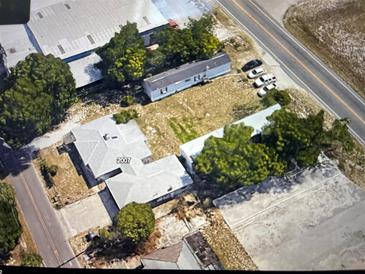 Aerial view of property with house, mobile home, and vacant lot at 2007 40Th Nw St, Winter Haven, FL 33881