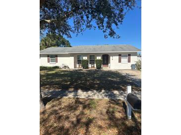 Single story home with a landscaped lawn and driveway at 618 Jupiter Way, Casselberry, FL 32707
