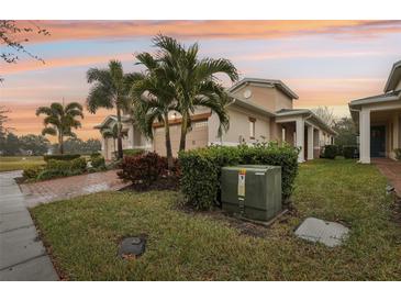 Two-story house with a two-car garage and landscaped yard at 2451 Datura Loop, St Cloud, FL 34772