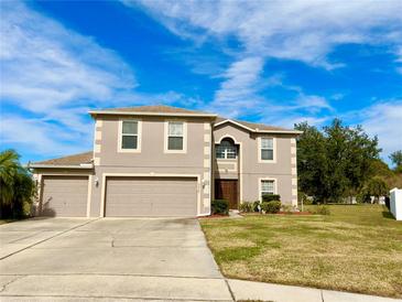 Two-story house with a two-car garage and a well-manicured lawn at 2403 Melissa Ann Ct, Kissimmee, FL 34746