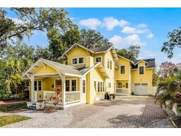 Beautiful two-story craftsman home with a large front porch and paved driveway at 2223 Amherst Ave, Orlando, FL 32804