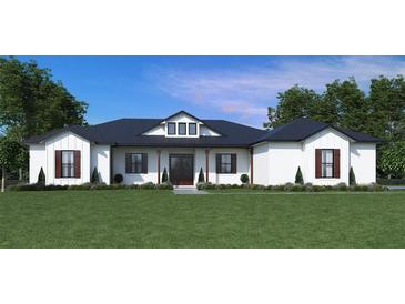 White farmhouse exterior with dark roofing, shutters, and a lush lawn at 3412 Lake Diane Rd, Tavares, FL 32778