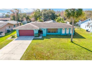 Ranch-style home with carport and spacious yard at 508 Bar Dr, Kissimmee, FL 34759