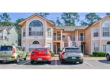 Two-story condo building with parking and landscaping at 2035 Royal Bay Blvd # 45, Kissimmee, FL 34746